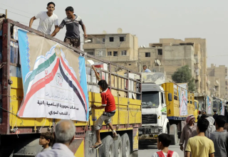 September 20, 2017, during a gathering of Syrians around a convoy of trucks loaded with Iranian aid in the city of Deir al-Zour