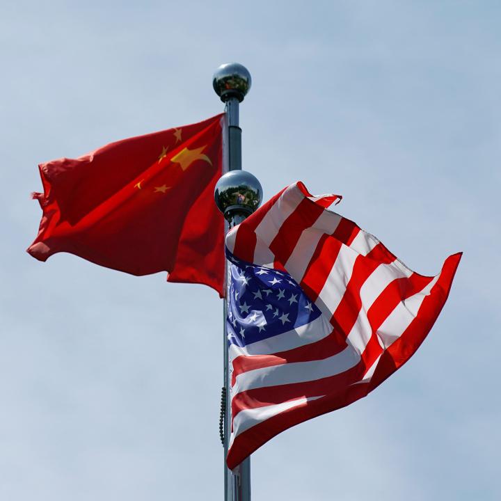 Chinese and U.S. flags flutter at a trade meeting in Shanghai