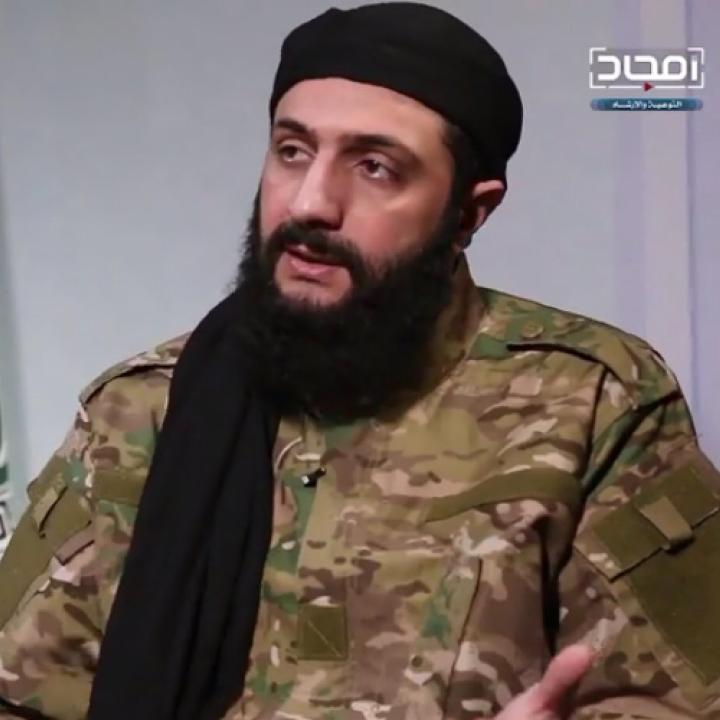 Abu Muhammad al-Jawlani, leader of Hayat Tahrir al-Sham, speaks in a recorded interview released in Jan. 2019. Photo credit: Screenshot by Cole Bunzel via Twitter.