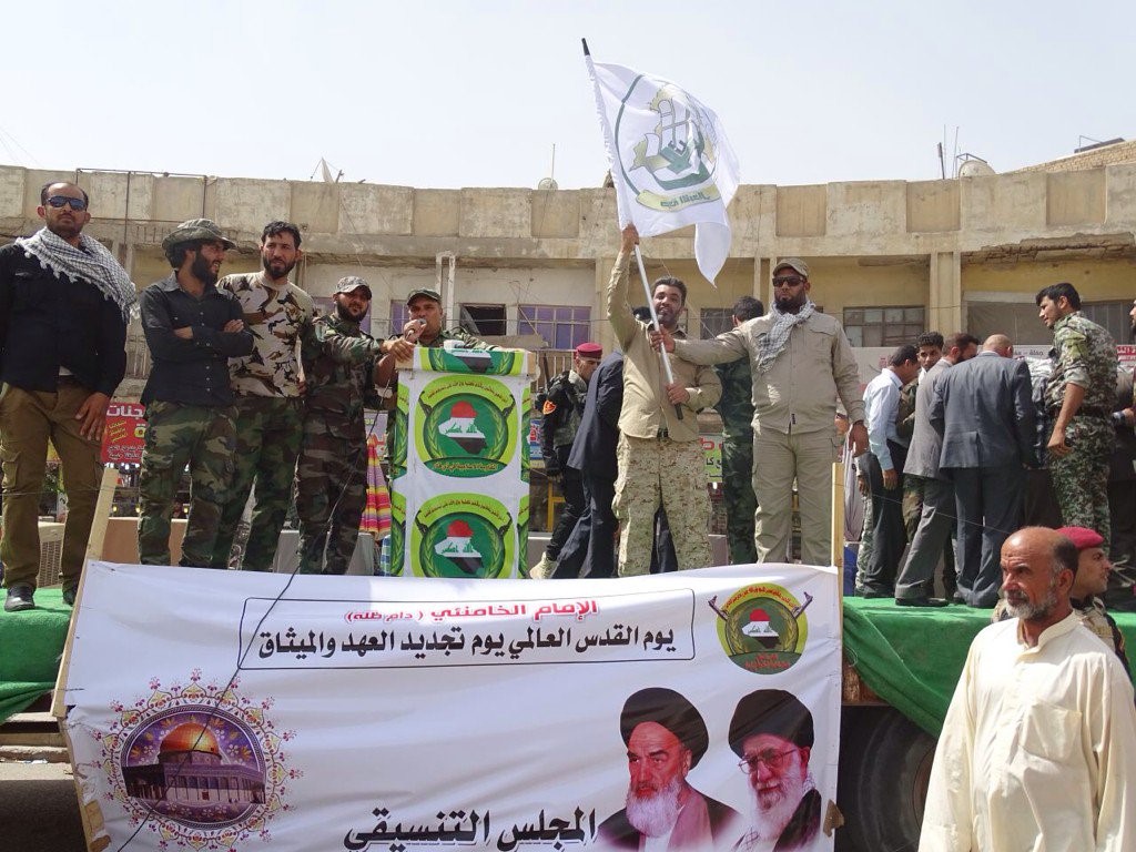 Harakat al-Abdal fighters with ortraits of Khomeini and Khamenei on Quds Day, 2016