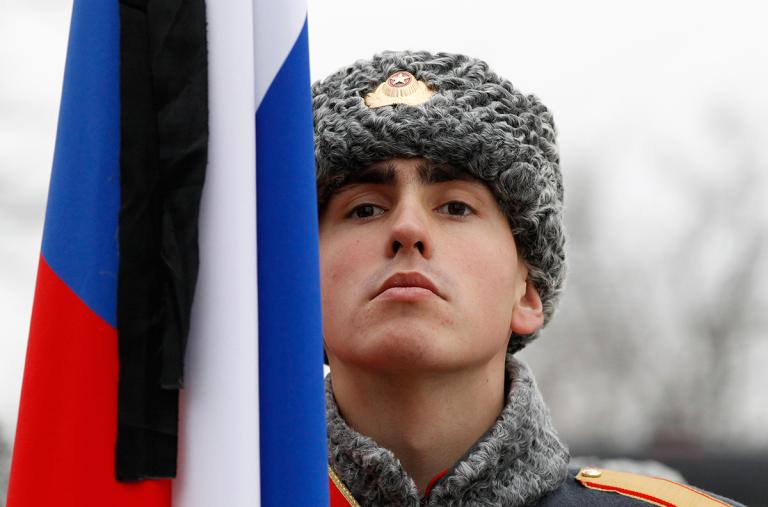 A Russian soldier and flag