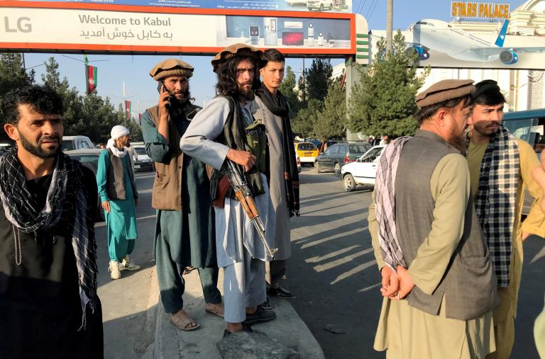 Photo showing Taliban fighters outside Kabul Airport, August 2021.