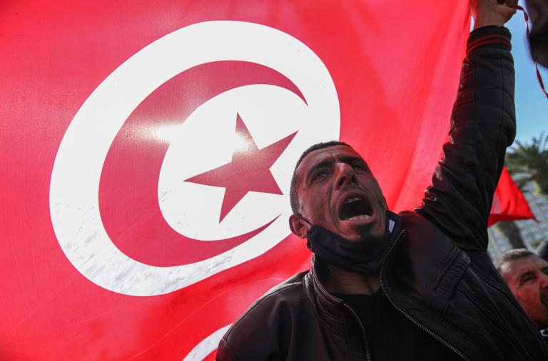 A supporter of Tunisia's Islamist Ennahda Party protests against the Tunisian president's 2022 coup - source: Reuters