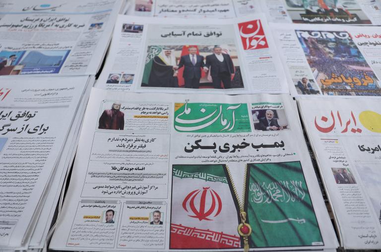 Newspapers at a shop in Tehran display headlines about the China-brokered Iran-Saudi deal in March 2023 - source: Reuters