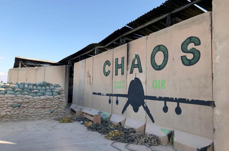 Photo of a blast wall with a drone mural at al-Asad Air Base in Iraq.