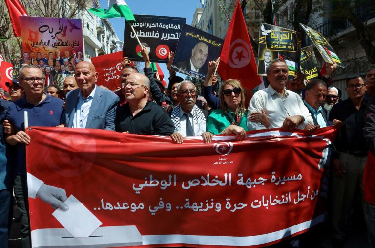 Imed Khemiri, a senior official in the Ennahda party and member of the Salvation Front (L) takes part in a protest, demanding the release of imprisoned journalists, activists, opposition figures and setting a date for fair presidential elections in Tunis, Tunisia May 12, 2024 - source: Reuters