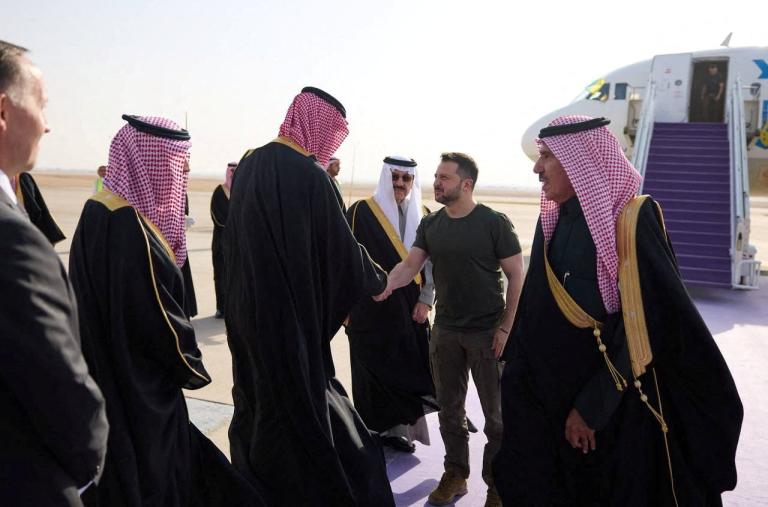 Photo showing Ukraine's President Zelensky greeting Saudi officials on the tarmac. 