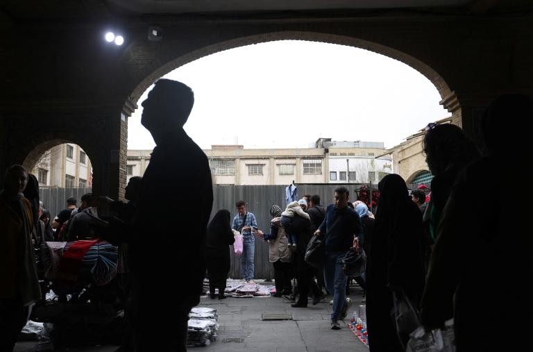 Iranians shop in a Tehran market ahead of Nowruz celelbrations in 2024 - source: Reuters