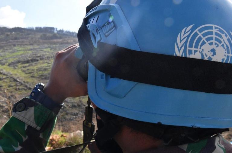 A United Nations peacepeeker scans the terrain in southern Lebanon - source: Untied Nations