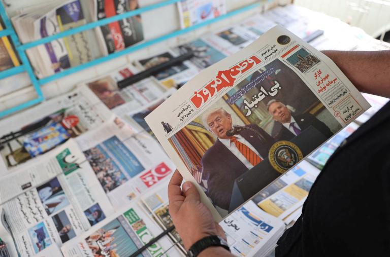 A man holds a newspaper featuring a photograph of U.S. President Trump and his Middle East advisor, Steve Witkoff, in Tehran - source: Reuters
