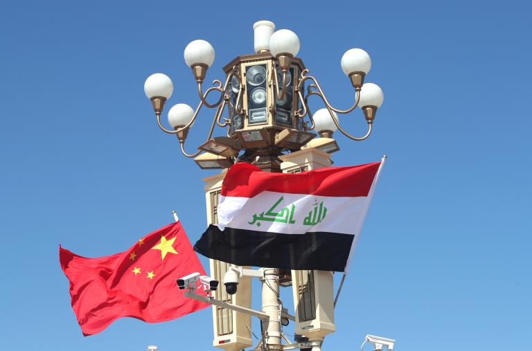 Chinese and Iraqi flags fly in Beijing during a state visit - source: Reuters