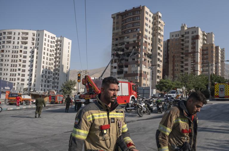 Emergency crews work at the scene of an Israeli air strike in Tehran in June 2025 - source: Reuters