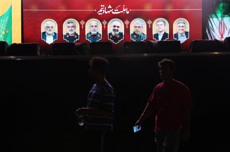 A sign in Tehran displays images of officials in Iran's nuclear program killed in Israeli airstrikes in June 2025 - source: Reuters