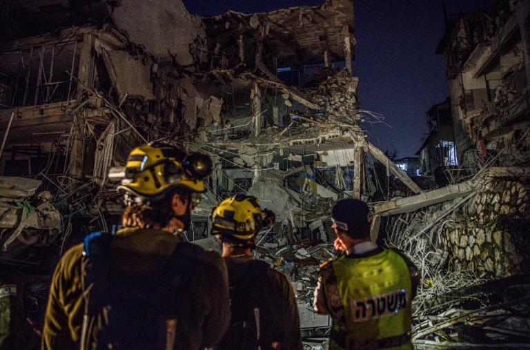 Israeli firefighters work at the site of in Iranian missile strike on a residential building in Tel Aviv in June 2025 - source: Reuters