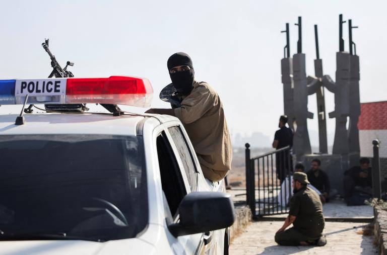 Bedouin fighters stopped at a government checkpoint near Suwayda in July 2025 - source: Reuters