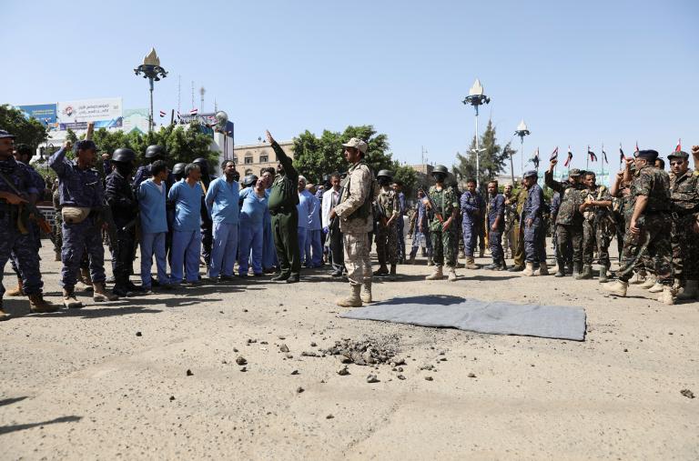 Soldiers stand guard next to men convicted of involvement in the 2018 killing of top Houthi leader Saleh al-Samad before their execution at Tahrir Square in Sanaa, Yemen in September 2021 - source: Reuters