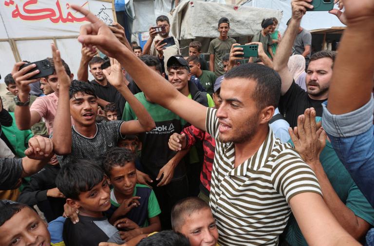Palestinians celebrate news of a ceasefire between Israel and Hamas in October 2025 - source: Reuters