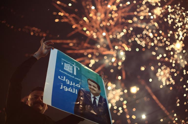 Supporters of Iraqi prime minister al-Sudani celebrate with fireworks as results of the country's November 2025 parliamentary elections are announced - source: Reuters