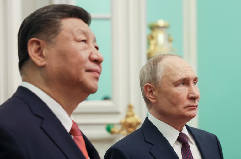 Close-up photo of Chinese leader Xi and Russian leader Putin.