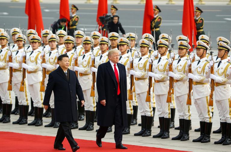 Chinese president Xi walks with U.S. president Trump in Beijing in 2017 - source: Reuters