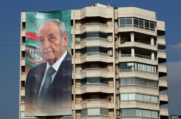 Photo of a large banner on a building in Lebanon showing Speaker of Parliament Nabih Berri.
