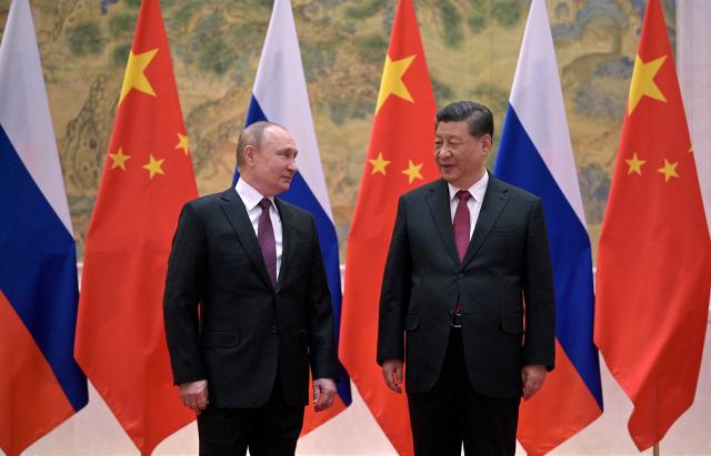 Russian President Vladimir Putin meets Chinese President Xi Jinping at a summit in Beijing - source: Reuters