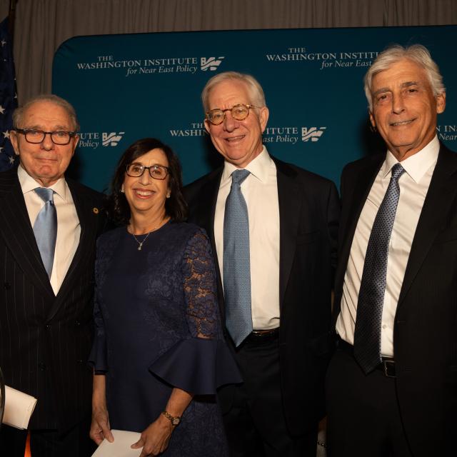 Institute Trustee Roger Hertog (left) and President Jay Bernstein (right) honor Shelly and Michael Kassen.