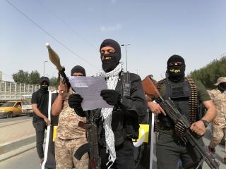 RA armed members taking part in an unsanctioned military parade in Baghdad alongside KH soldiers, March 25, 2021.