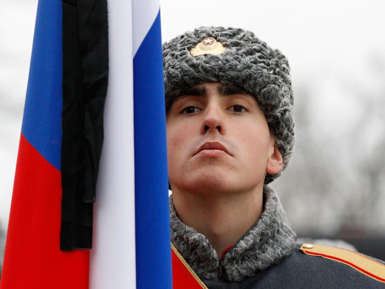 A Russian soldier and flag