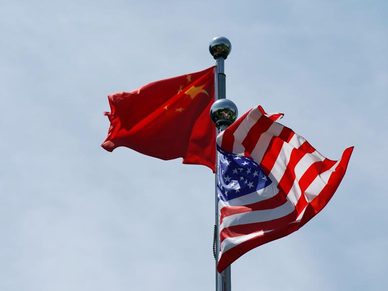 Chinese and U.S. flags flutter at a trade meeting in Shanghai