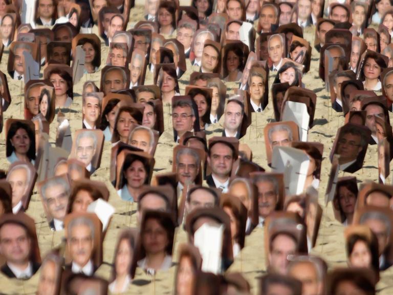Portraits of Baha'i adherents arrested in Iran on display in Brazil - source: Reuters