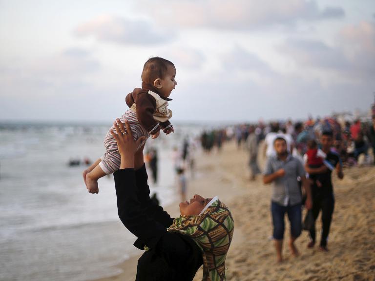Palestians on a Mediterranean beach in Gaza