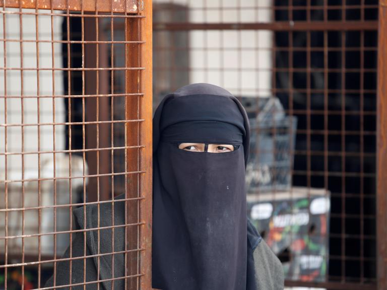 A woman at the Al-Hawl detention camp in Syria - source: Reuters