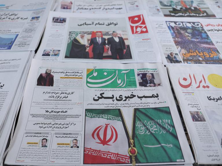 Newspapers at a shop in Tehran display headlines about the China-brokered Iran-Saudi deal in March 2023 - source: Reuters