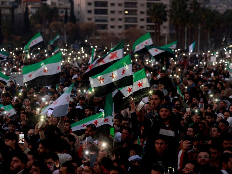 Syrian civilians celebrate the fall of the Assad regime in downtown Damascus in December 2024 - source: Reuters