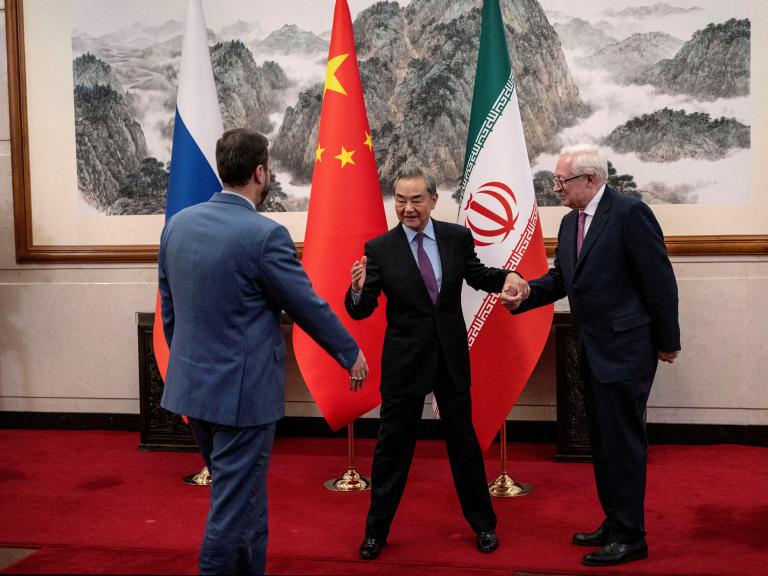 Chinese Foreign Minister Wang Yi greets Russian Deputy Foreign Minister Sergey Ryabkov and Iranian Deputy Foreign Minister Kazem Gharibabadi in Beijing in March 2025 - source: Reuters
