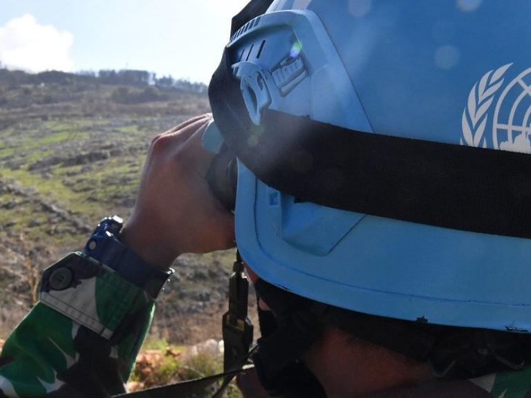 A United Nations peacepeeker scans the terrain in southern Lebanon - source: Untied Nations