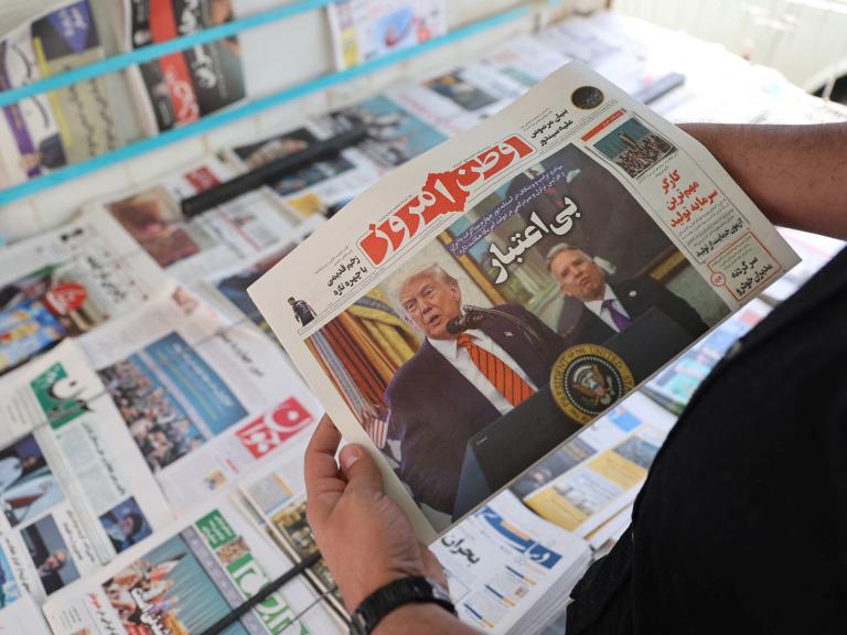 A man holds a newspaper featuring a photograph of U.S. President Trump and his Middle East advisor, Steve Witkoff, in Tehran - source: Reuters
