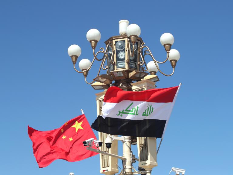 Chinese and Iraqi flags fly in Beijing during a state visit - source: Reuters