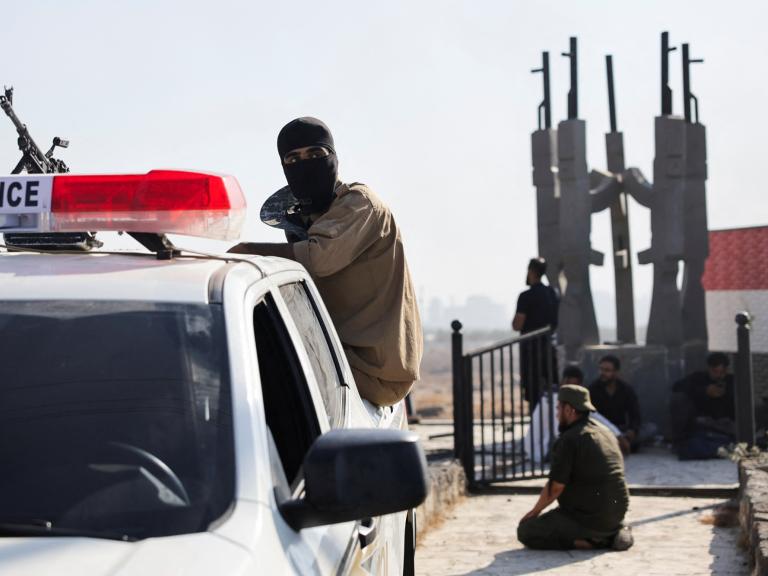 Bedouin fighters stopped at a government checkpoint near Suwayda in July 2025 - source: Reuters
