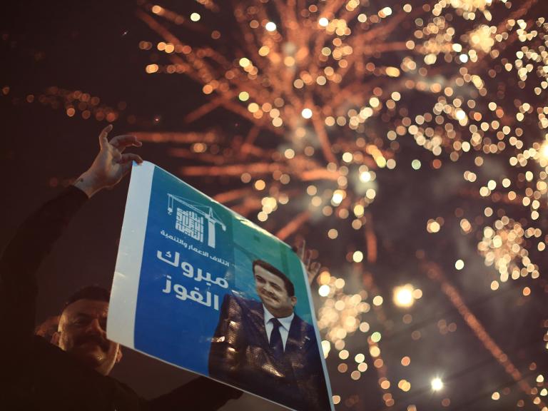 Supporters of Iraqi prime minister al-Sudani celebrate with fireworks as results of the country's November 2025 parliamentary elections are announced - source: Reuters