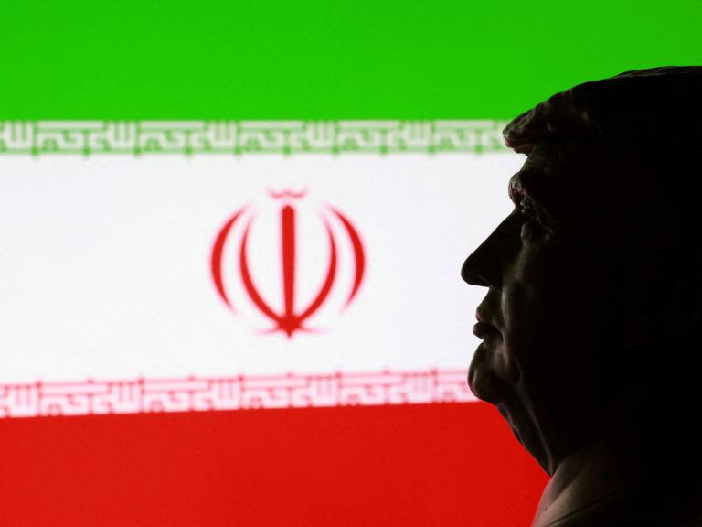A photo illustration of a bust of President Trump and an Iranian flag - source: Reuters