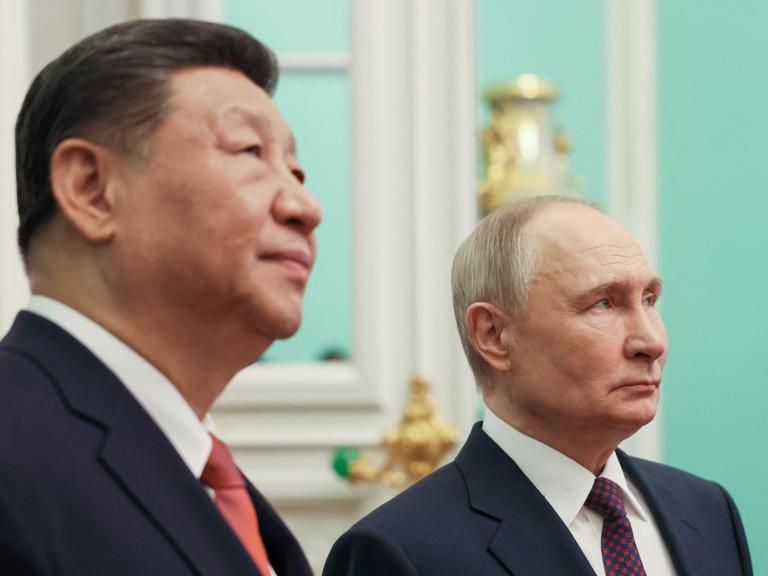 Close-up photo of Chinese leader Xi and Russian leader Putin.