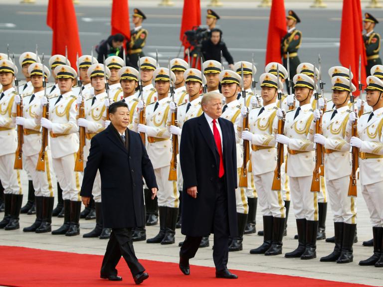 Chinese president Xi walks with U.S. president Trump in Beijing in 2017 - source: Reuters