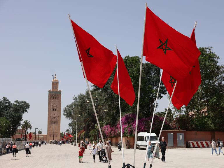 Moroccan flags fly in front of a mosque in Rabat - source: Reuters