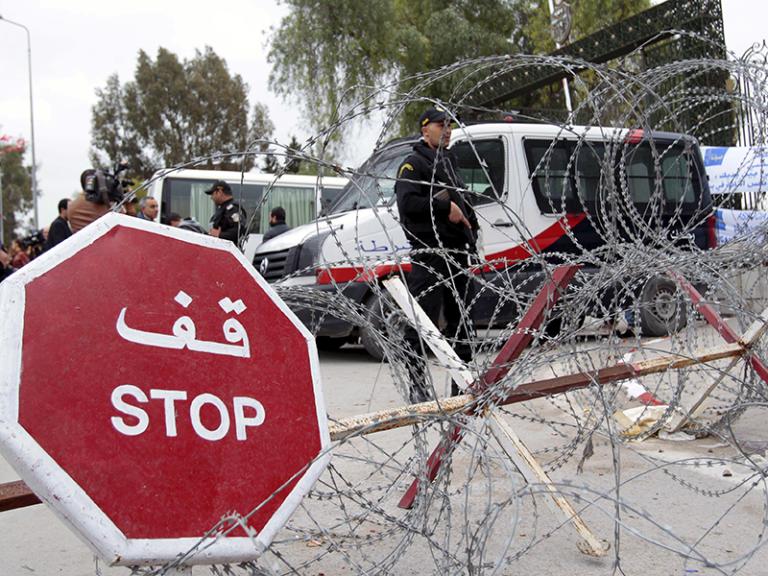 Tunisian police guard the site of a terrorist attack - soucre: Reuters