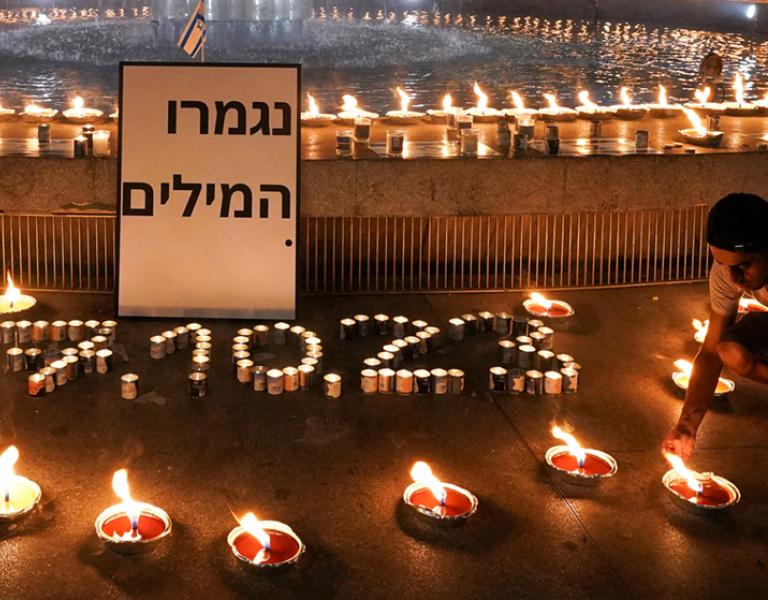 Mourners light candles to commemorate those killed in the 10/7 Hamas attacks - source: Reuters