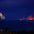 Photo showing flame and smoke rising over Lebanon's border with Israel.
