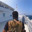 A Houthi fighter aboard the seized cargo vessel Galaxy Leader - source: Houthi media via Reuters