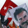 Demonstrators fly a mixture of Turkish flages featuring the image of the Republic of Turkey's founder, Kemal Mustafa Ataturk, and banners depicting Kurdish militia leader Abdullah Ocalan - source: Reuters